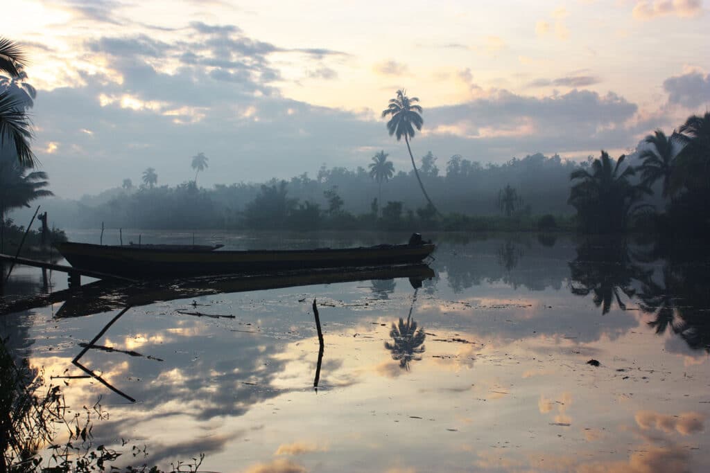 sunrise boat water asmat