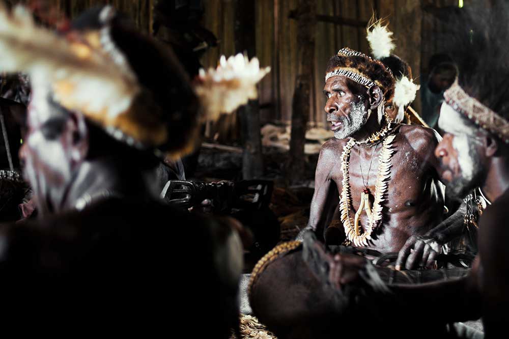 men sitting inside house